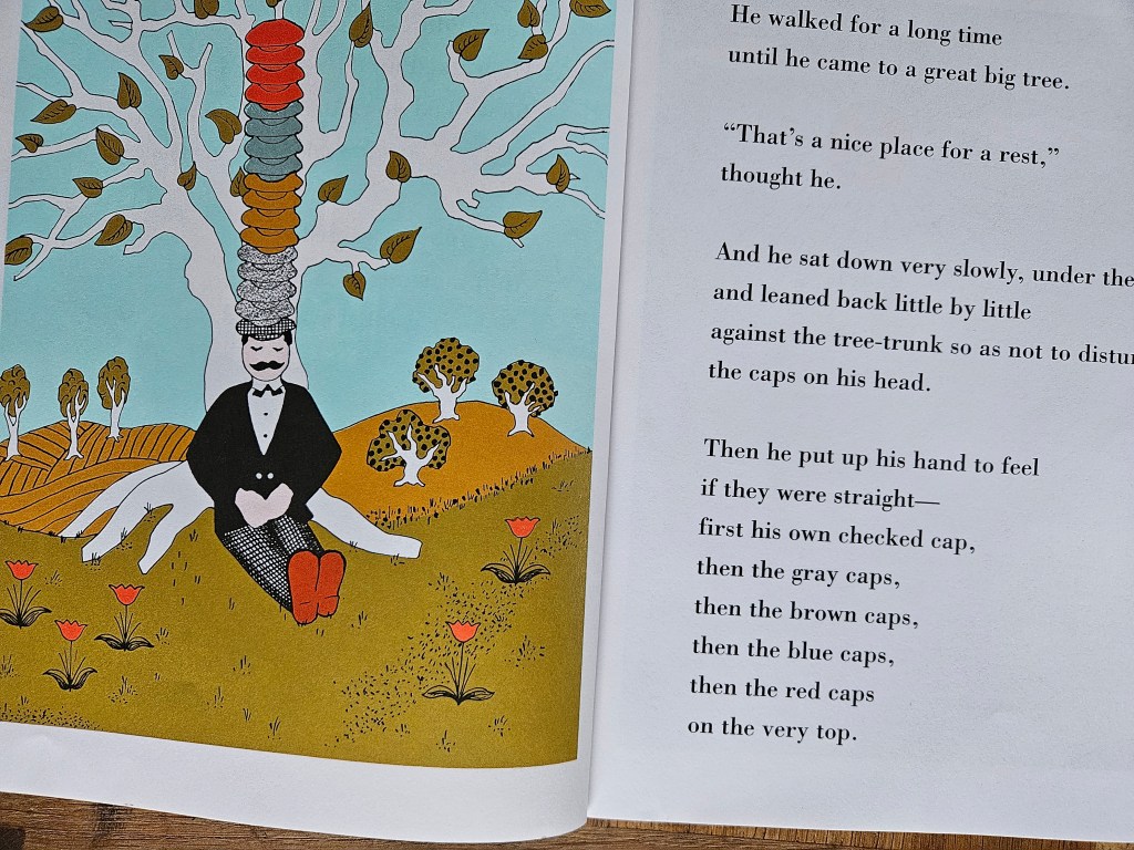 The man sits under a tree, careful not to upset his tower of caps.