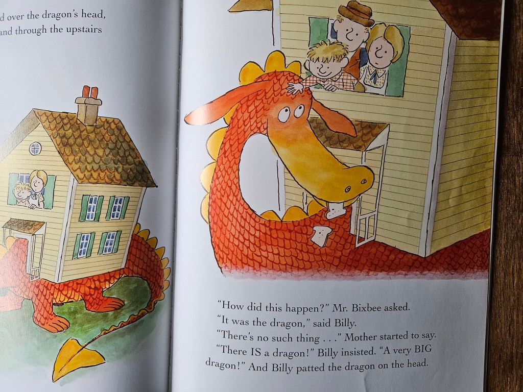 Giant red dragon lifting its head to the window where Billy and his parents stand smiling.