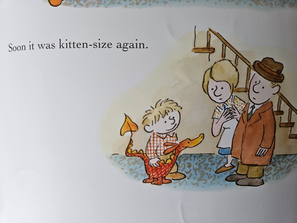 Small red dragon again at Billy’s feet as the family smiles.